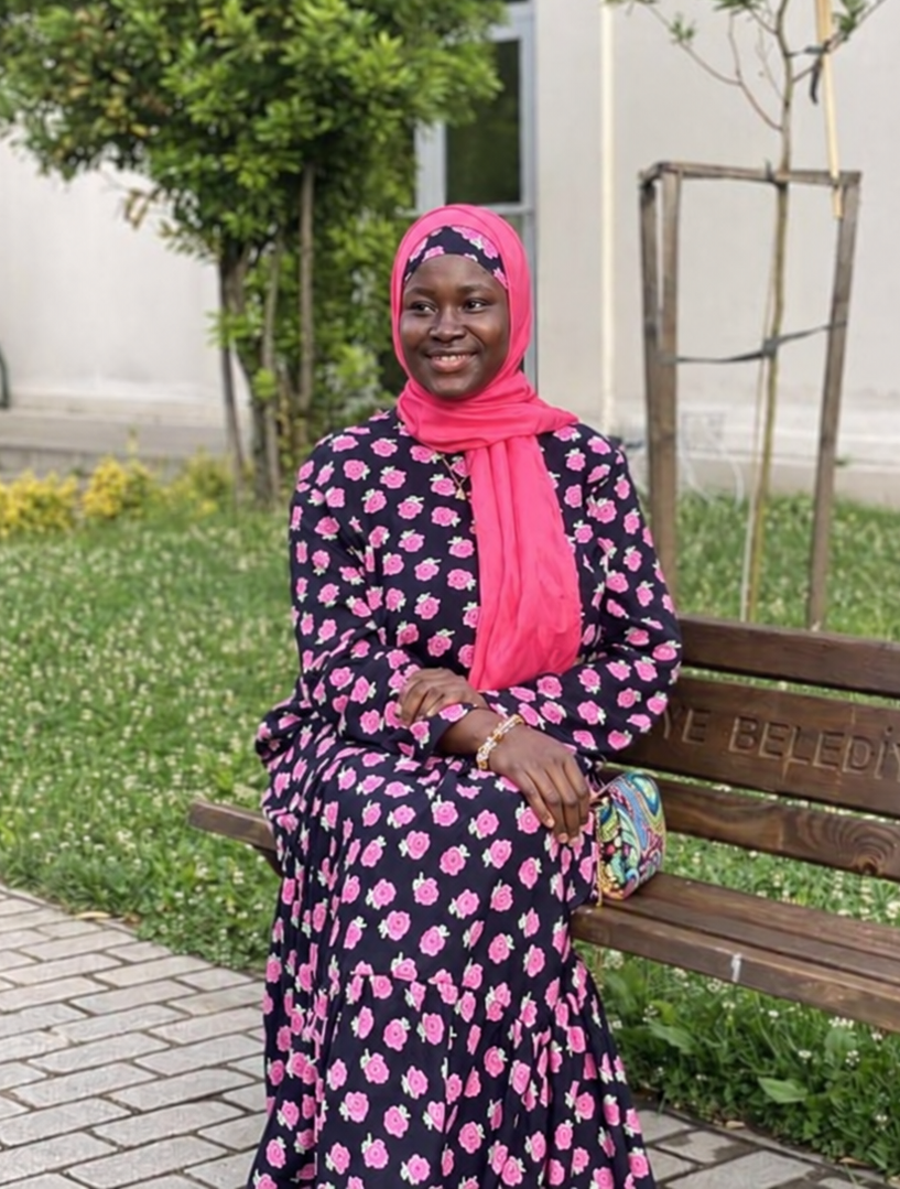 Saudat Kamarre-Deen, Founder of Globally Green, seated outdoors