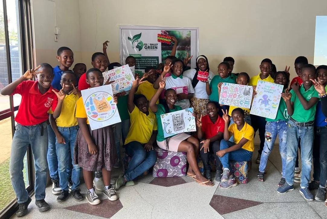 Students celebrating their Recycle Arts Campaign creations